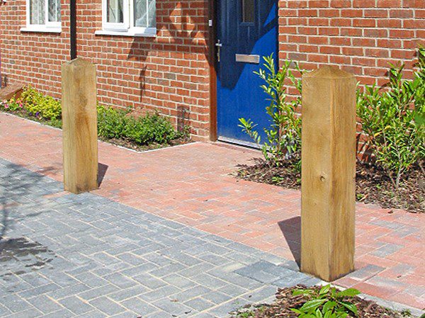 timber bollards outside a house