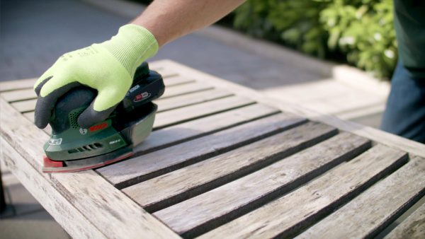 sanding wooden benches